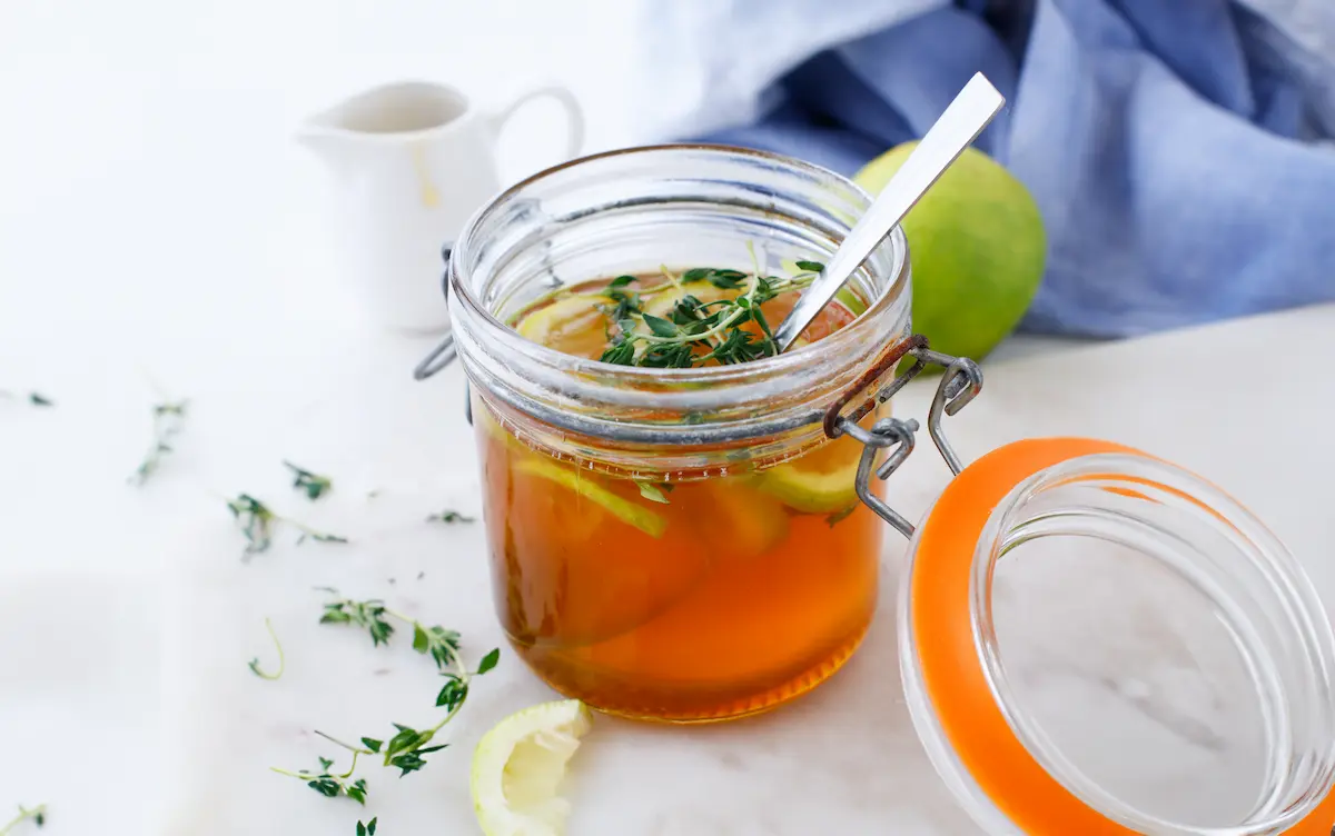 jar of thyme infused honey for a homemade cough syrup